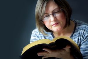 Woman reading the Holy Bible