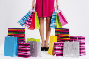 Woman with too many shopping bags