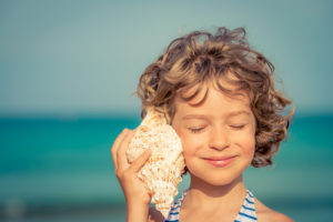 Girl Listening with Conch