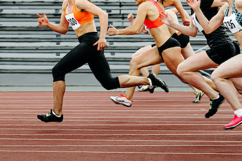 Women running comparison race.