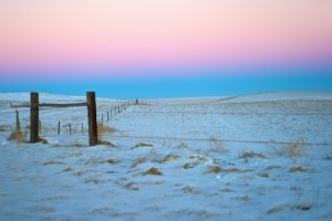 Prairie, snow, nowhere to hide, can't hide from God but He offers grace when found